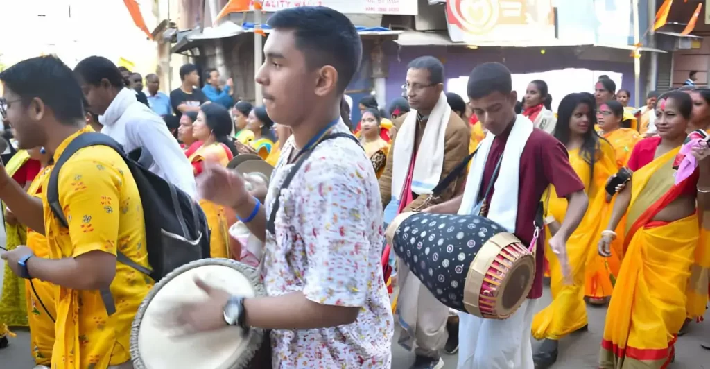 Followers of ISKCON society celebrating for Pran Pratistha ceremony of idol of Ram Lalla, in Ram Mandir at Ayodhya by grooving to music played in rally